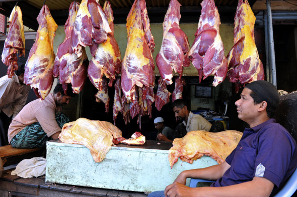 Indian Muslim butchers sell beef during