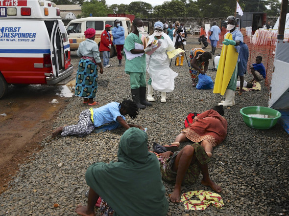 Ebola victims lay on the road, waiting to be treated, in Liberia.
